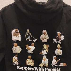 The Limited Black Hoodie with Rappers and Puppies Graphic